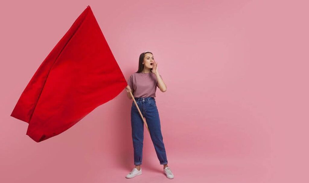 woman holding a red flag
