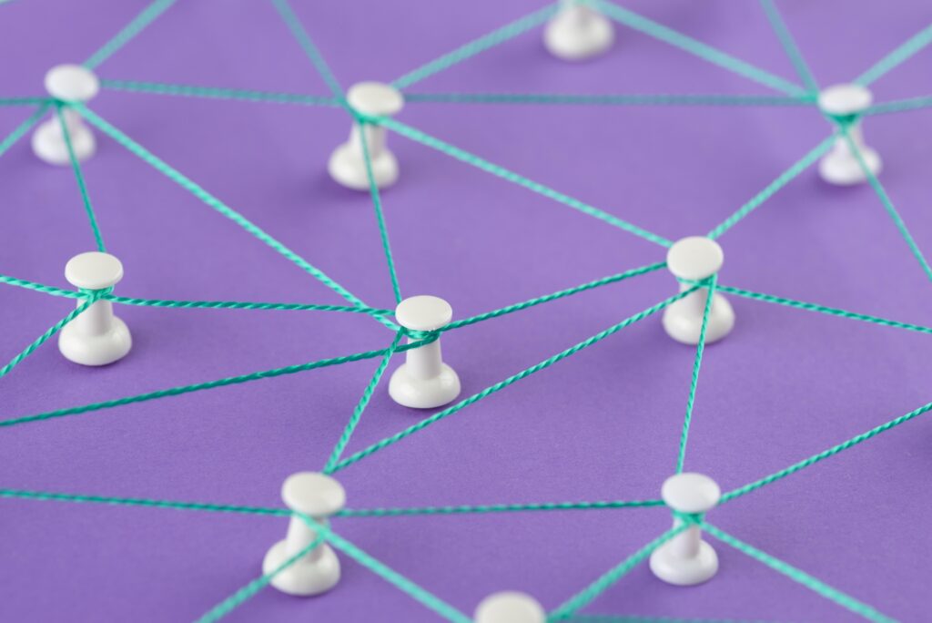 Network concept with thread representing the four must-haves for a solid cxm partnership